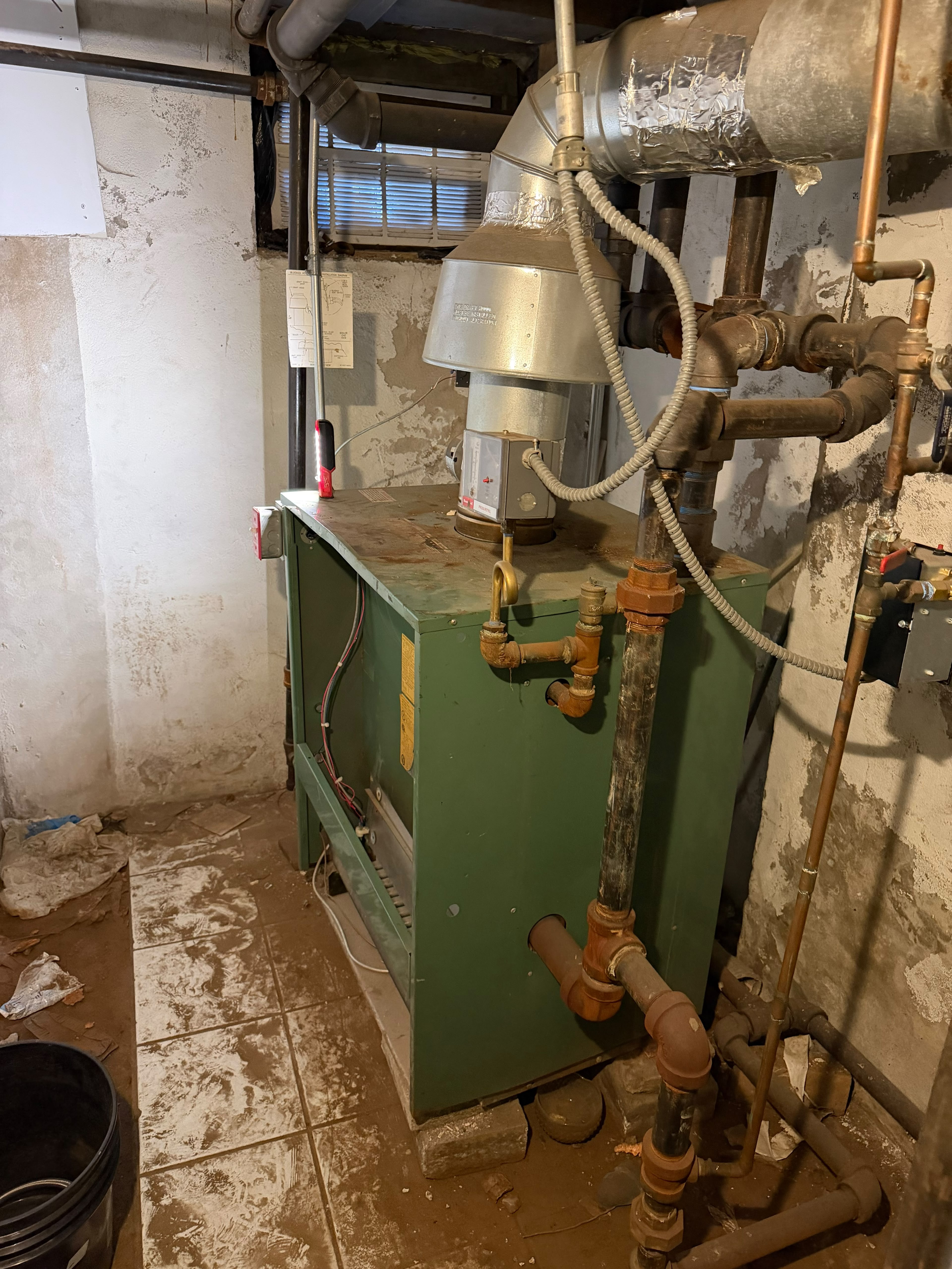 New Yorker gas steam boiler after thermocouple and safety relief valve replacement in a Crown Heights brownstone basement on Park Place