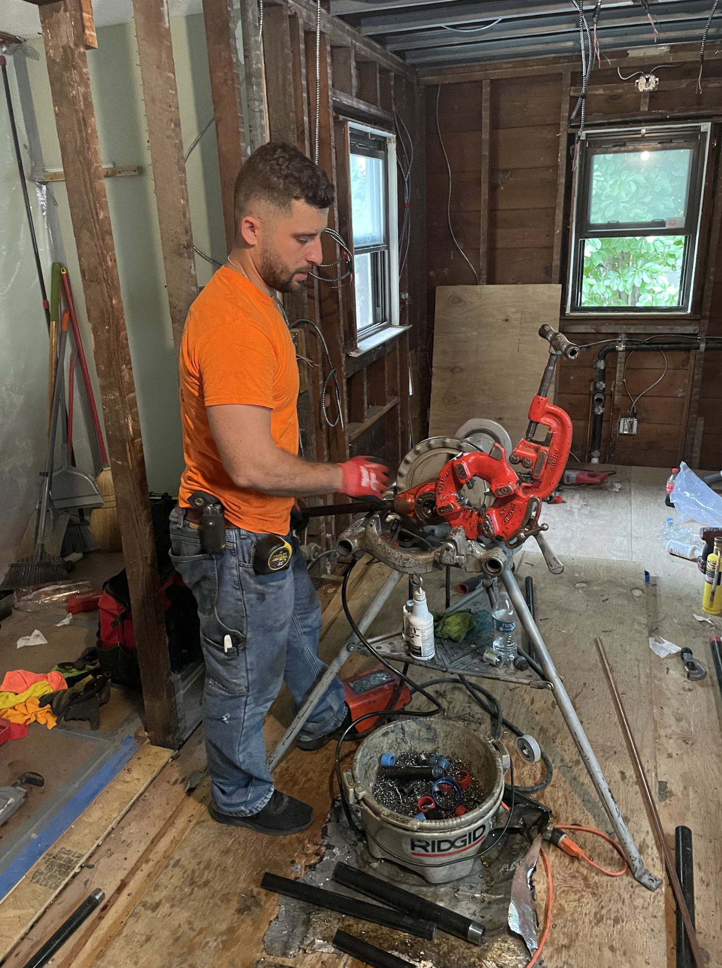Aleksander Veshaj threading new copper pipe on a gut renovation in Ridgewood, Queens